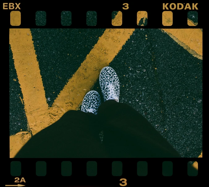 a person standing in the middle of a street, a picture, inspired by Elsa Bleda, unsplash, video art, white with black spots, sneaker photo, super 8mm, instagram post