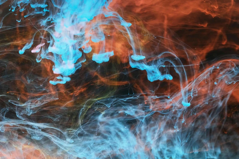 a close up of a blue and orange substance, inspired by Kim Keever, pexels, splashes of neon galaxies, blue and white and red mist, unsplash photo contest winner, fluid lines