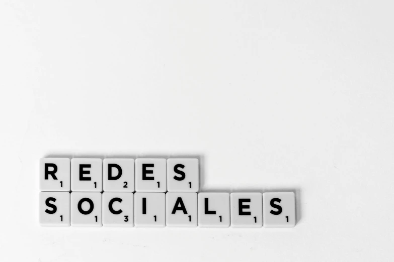 the word redes sociales spelled in scrabbles on a white surface, a poster, by Hirosada II, pexels, les automatistes, hermes ad, socialist, it specialist, images on the sales website