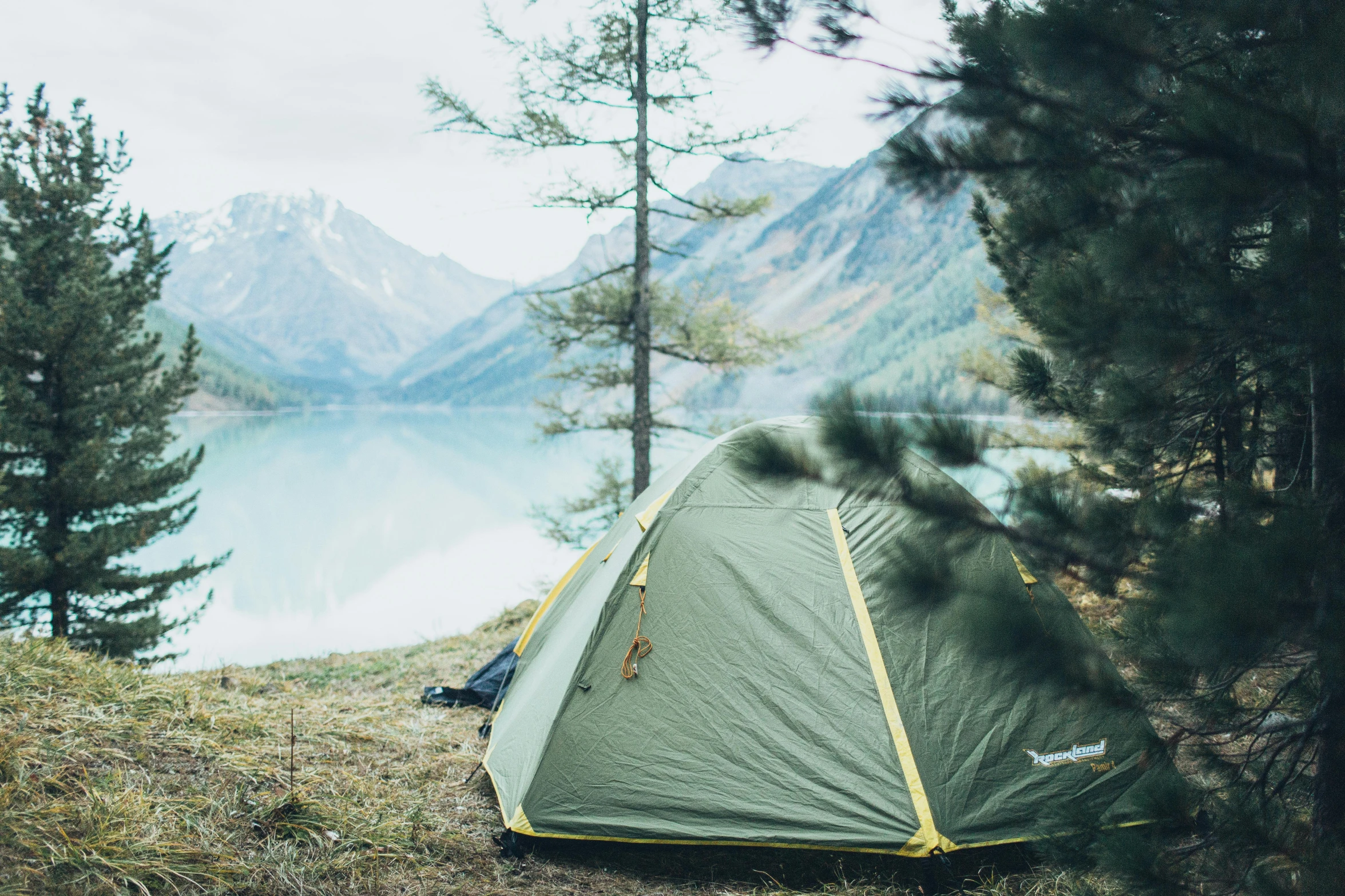 a tent pitched up on the side of a mountain, a picture, unsplash contest winner, hurufiyya, build in a forest near of a lake, 000 — википедия, with a tree in the background, instagram post