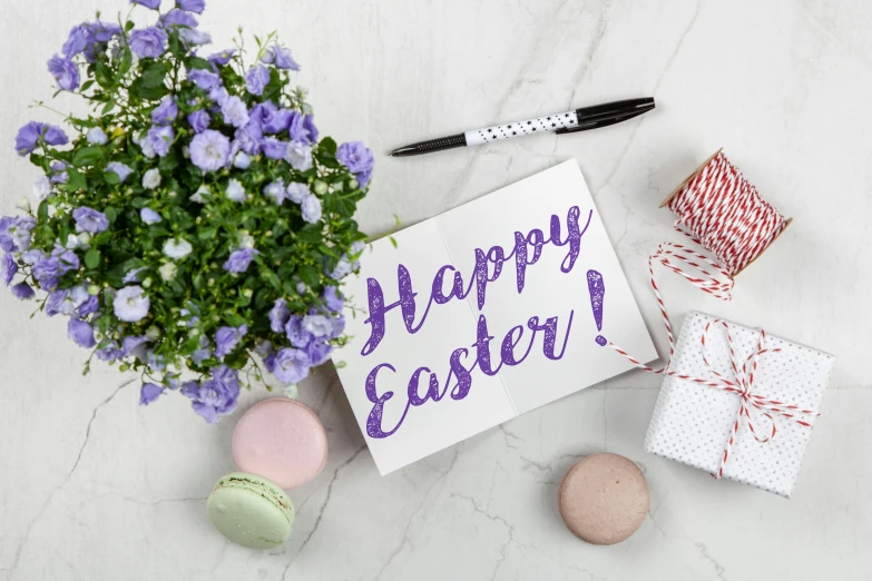 a bouquet of purple flowers next to a card that says happy easter, pexels contest winner, on a white table, listing image, background image, tourist photo