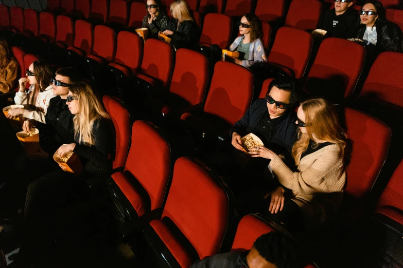 a group of people sitting in a movie theater