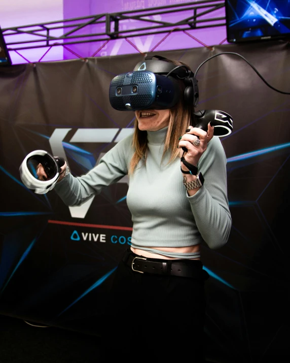 a woman wearing a pair of virtual reality headsets, standing in an arena, i és complex, eve venture, thumbnail