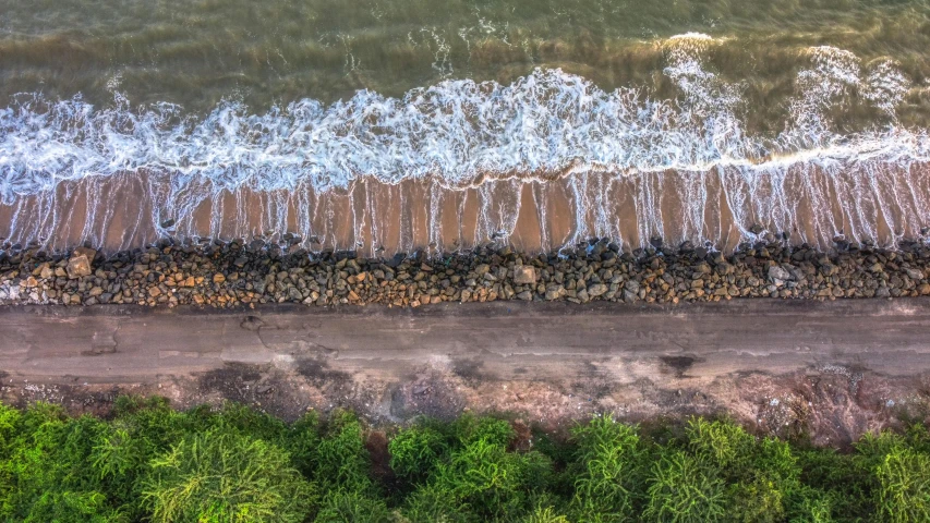 a large body of water next to a beach, by Daniel Lieske, pexels contest winner, land art, flatlay, rivulets, thumbnail, 8k quality