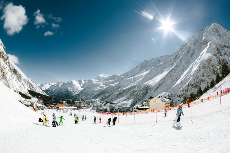 a group of people riding skis down a snow covered slope, by Tobias Stimmer, pexels contest winner, panoramic view, 🦩🪐🐞👩🏻🦳, sun overhead, school class