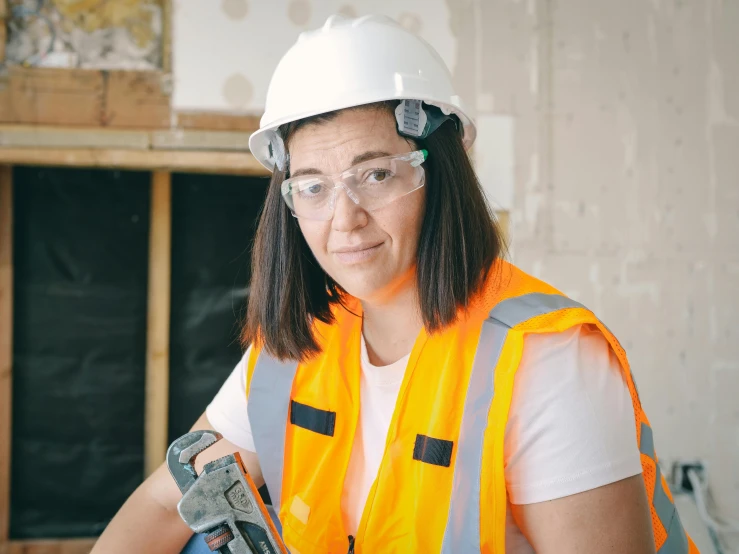 a woman wearing a hard hat and safety glasses, by Jeka Kemp, mitre, bulky build, rectangle, asher duran