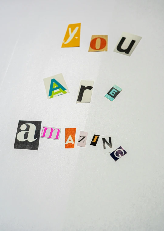 a refrigerator with the words you are amazing written on it, letterism, cut-out paper collage, naoya tanaka, up close image, imagine