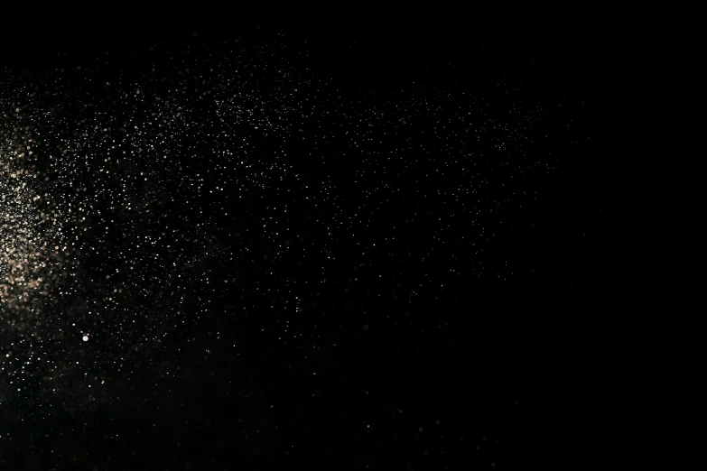 a man flying through the air while riding a snowboard, an album cover, by Aleksander Kobzdej, pexels, light and space, black sky full of stars, glitter gif, background image, solid black #000000 background