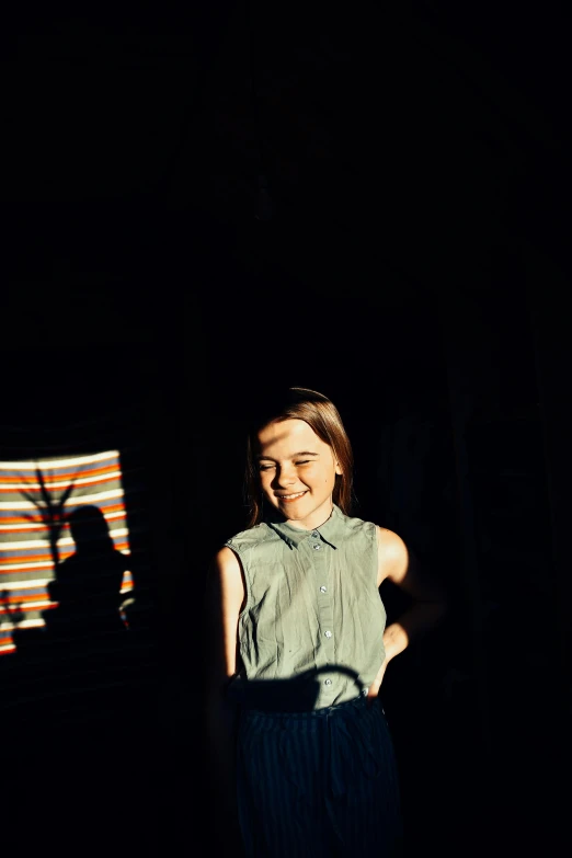 a woman standing in front of an american flag, a polaroid photo, by Pamela Ascherson, unsplash, sunlight shining through windows, kiernan shipka, his smile threw shadows, late 1 9 6 0's