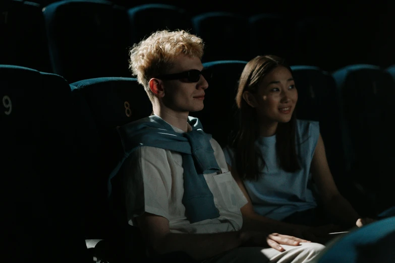 a couple of people sitting in a movie theater, trending on pexels, video art, avatar image, summer season, cinematic outfit photo, sci-fi movie