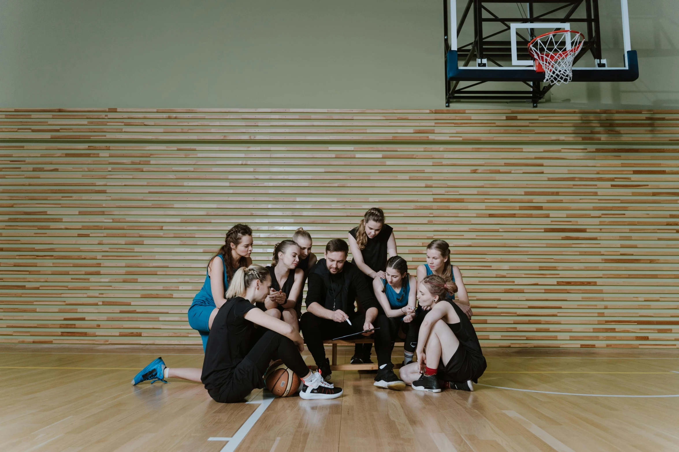 a group of young women sitting on top of a basketball court, pexels contest winner, danube school, profile image, indoor picture, thumbnail