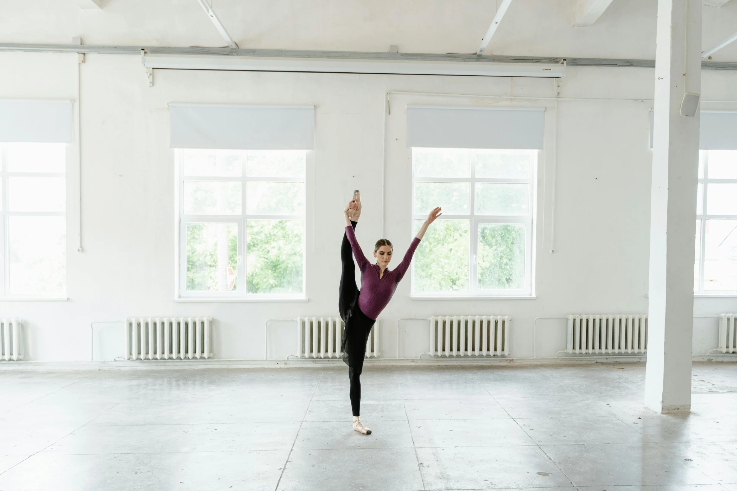 a woman doing a handstand in an empty room, by Elizabeth Polunin, pexels contest winner, arabesque, with arms up, anna nikonova aka newmilky, square, white background