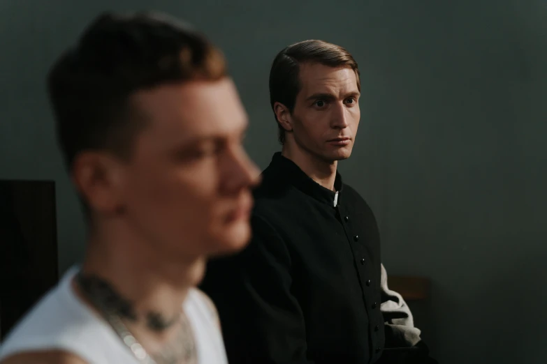 two men standing next to each other in a room, an album cover, by Adam Marczyński, pexels contest winner, vitalik buterin, [ theatrical ], servants, looking to the side off camera