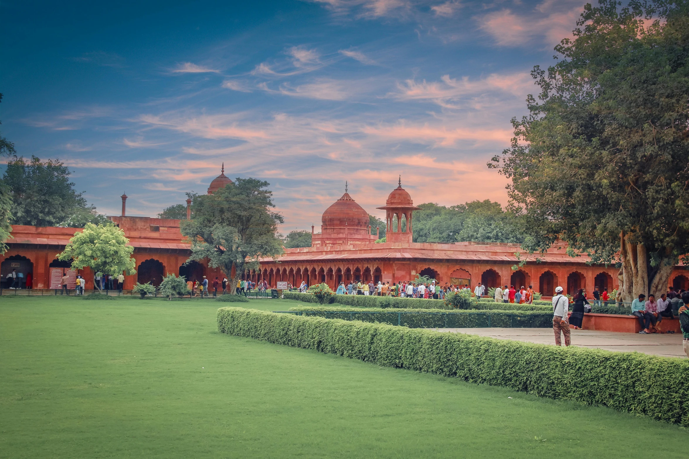 a group of people standing in front of a building, inspired by Steve McCurry, unsplash contest winner, renaissance, royal garden background, lawns, mogul khan, panoramic shot