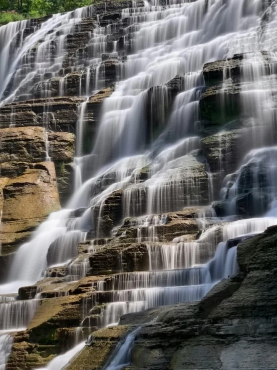 a large waterfall in the middle of a forest, shiny layered geological strata, award - winning photo ”, today\'s featured photograph 4k, pareidolia