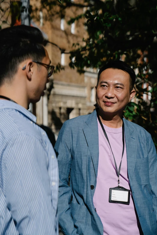 a couple of men standing next to each other, unsplash, renaissance, asian descent, teaching, on location, rome