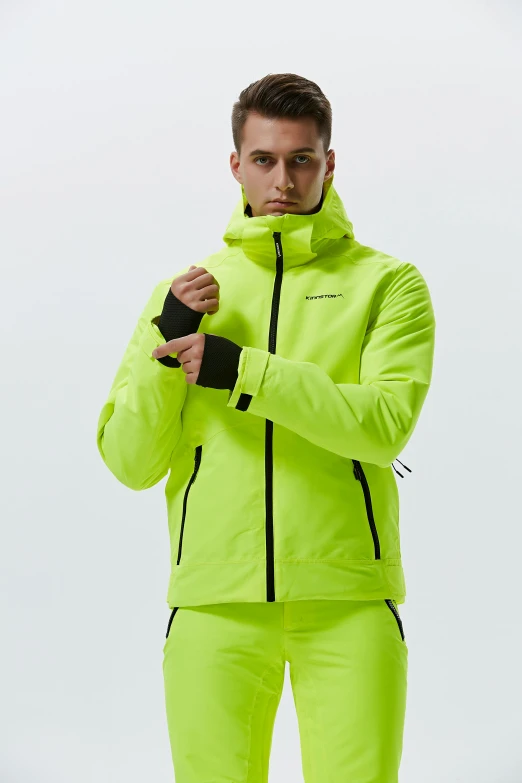 a man in a bright green jacket and pants, model is wearing techtical vest, colors: yellow, detailed product shot, atmoshperic