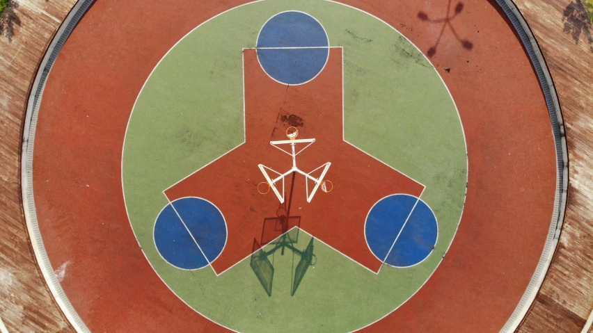 a basketball court with a bicycle painted on it, an album cover, by Attila Meszlenyi, conceptual art, dragonfly-shaped, pentagrams, round-cropped, le corbusier