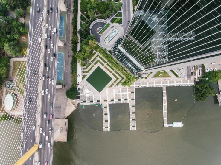 a view of a city from a bird's eye view, an album cover, inspired by Tadao Ando, pexels contest winner, parks and lakes, hong kong buildings, mies van der rohe, elegant walkways between towers