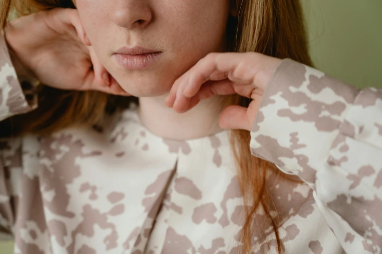 a close up of a person wearing a shirt, inspired by Cecily Brown, trending on pexels, delicate patterned, natural soft pale skin, teenage girl, camouflage