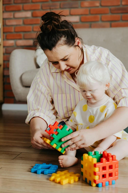 a woman playing with a child on the floor, a jigsaw puzzle, pexels contest winner, chunky build, thumbnail, inspect in inventory image, made of lego