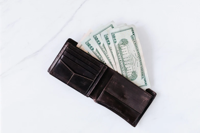 a wallet with money sticking out of it, an etching, unsplash, with a square, cost, battered, chocolate