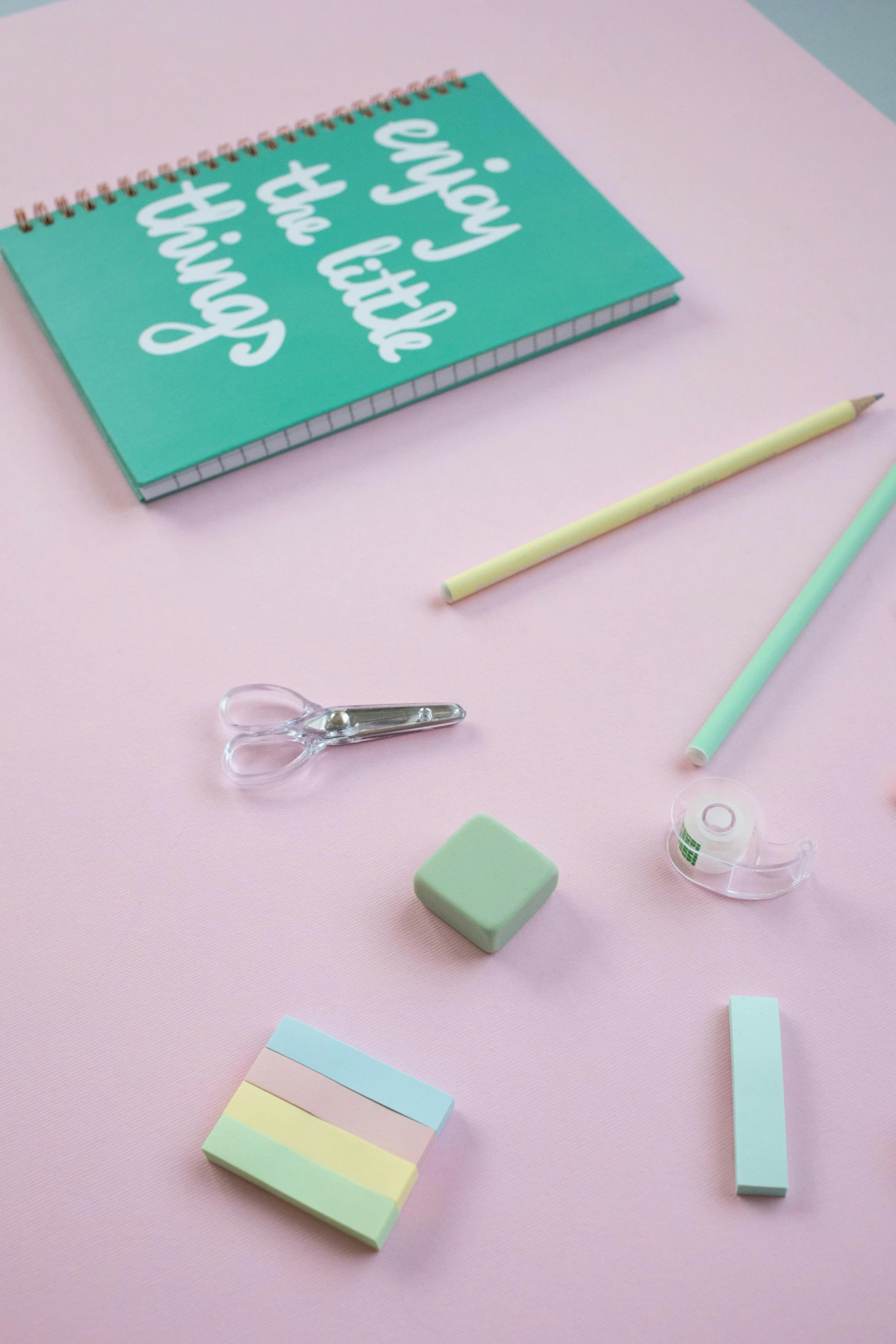 school supplies laid out on a pink surface, by Lucette Barker, trending on pexels, light green, soft coloured gel lighting, mint, lots de details