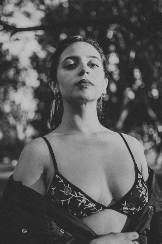 a black and white photo of a woman in a bra top, a black and white photo, by Alexis Grimou, unsplash, renaissance, isabela moner, al fresco, kat dennings, album cover