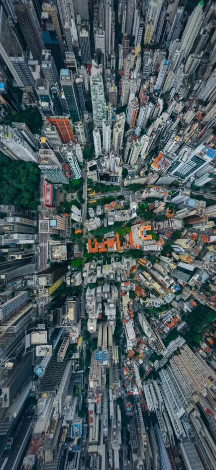 an aerial view of a city with lots of tall buildings, by Joze Ciuha, unsplash contest winner, photorealism, cgsociety 8k, favela spaceship cathedral, bird\'s eye view, smartphone photography