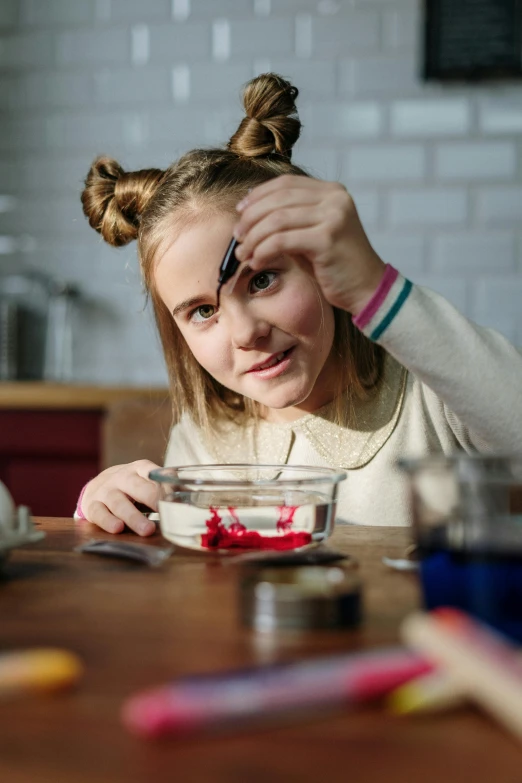 a little girl that is sitting at a table, experimenting in her science lab, squashed berry stains, teenage girl, plating