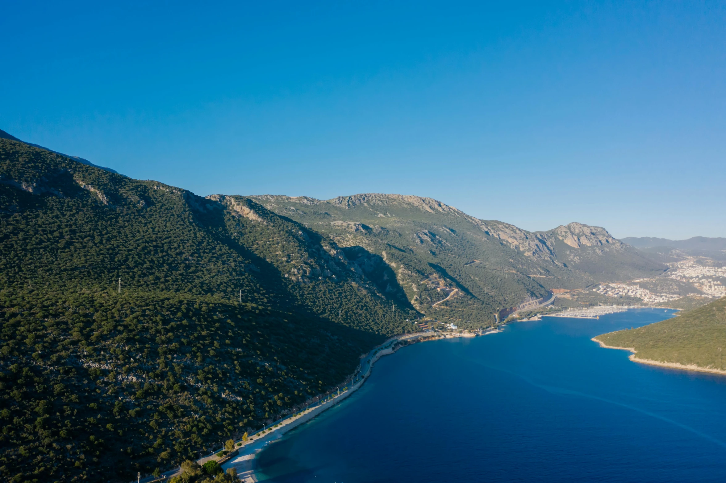 a large body of water surrounded by mountains, pexels contest winner, les nabis, greek nose, aerial footage, picton blue, conde nast traveler photo