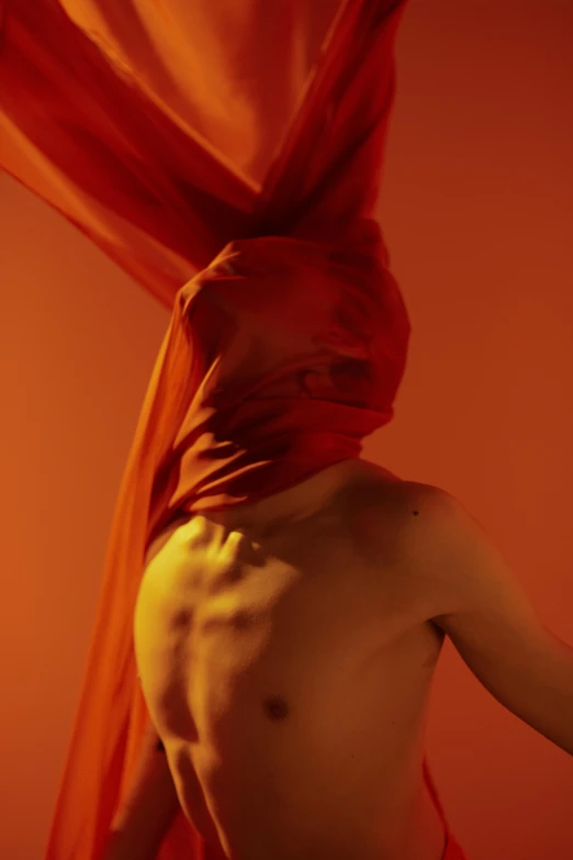 a naked man with a red scarf on his head, an album cover, pexels contest winner, conceptual art, light red and deep orange mood, showstudio, ignant, silks