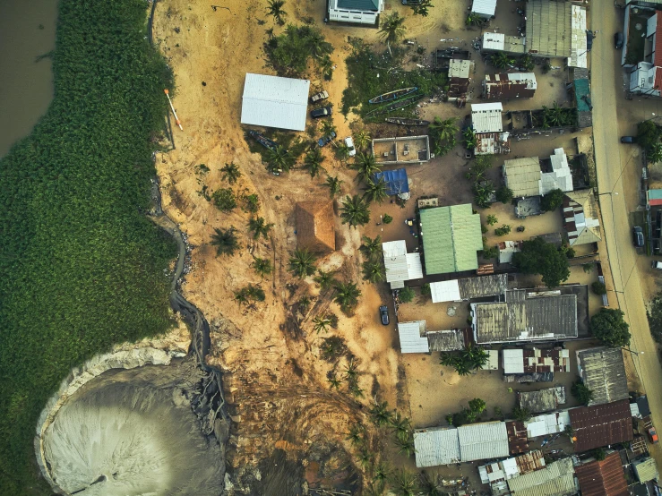 a bird's eye view of a small village, an album cover, pexels contest winner, coastal, devastation, thumbnail, brown