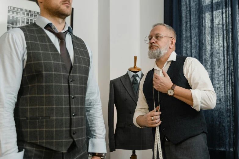 two men standing next to each other in a room, pexels contest winner, tailored clothing, intricate lining, thumbnail, inspect in inventory image