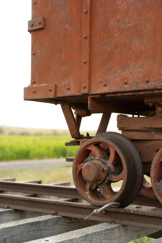 a close up of a train on a train track, preserved museum piece, mine cart, head to waist, uncrop