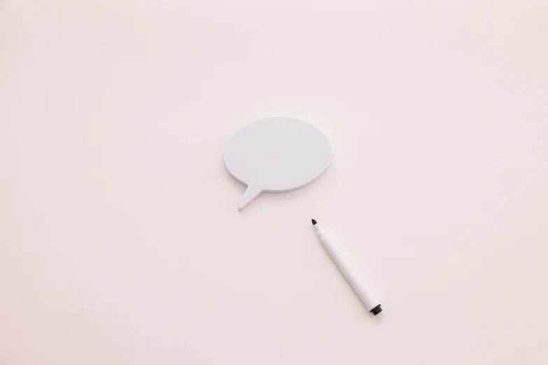 a pen sitting on top of a white surface next to a speech bubble, by Karl Buesgen, unsplash, conceptual art, pastel pink, white plastic, miniature product photo, gray