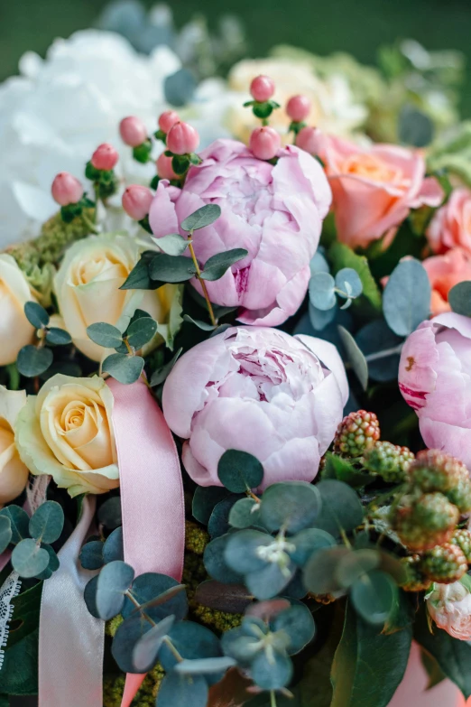 a close up of a bouquet of flowers on a table, with soft bushes, wrapped in flowers, no cropping, comforting