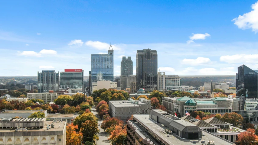 a view of a city from the top of a building, listing image, capital plaza, skybox, multiple stories