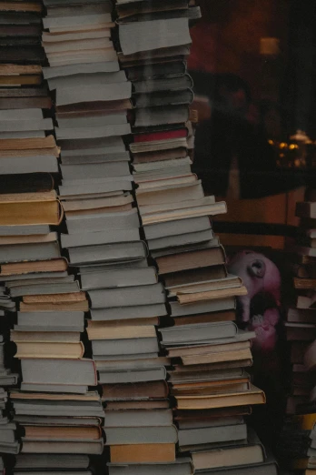 a stack of books sitting on top of a table, piles of bodies, top selection on unsplash, profile picture, stores