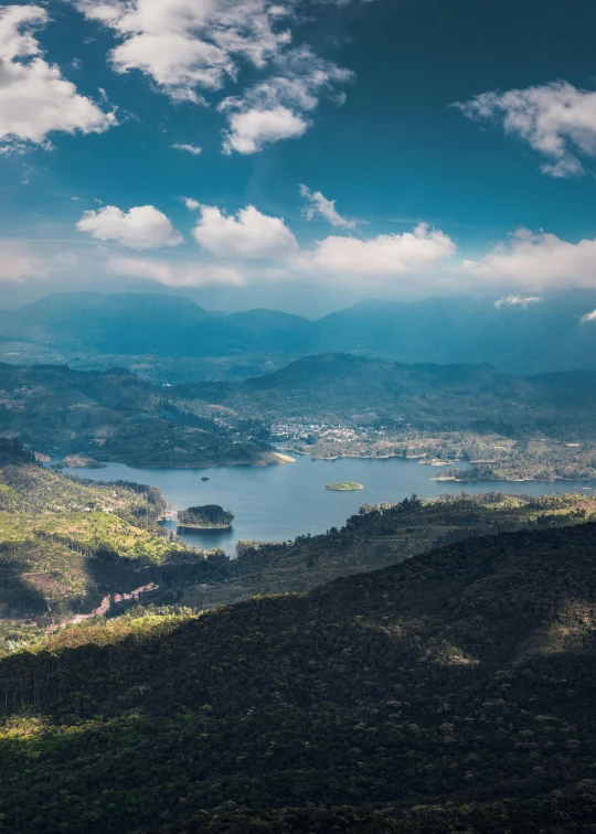 a view of a lake and mountains from the top of a hill, by Alejandro Obregón, pexels contest winner, sumatraism, 4 k cinematic panoramic view, nepal, surrounding the city, today\'s featured photograph 4k