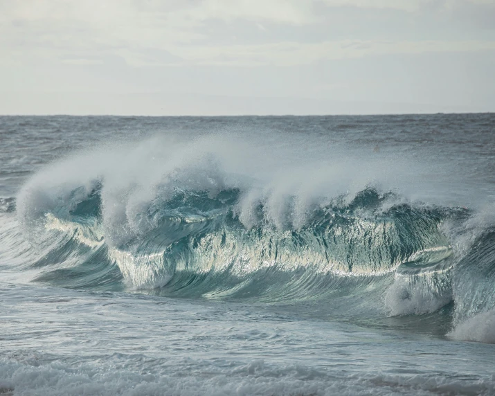 a person riding a surfboard on a wave in the ocean, pexels contest winner, fine art, paul barson, glistening seafoam, an enormous, maui