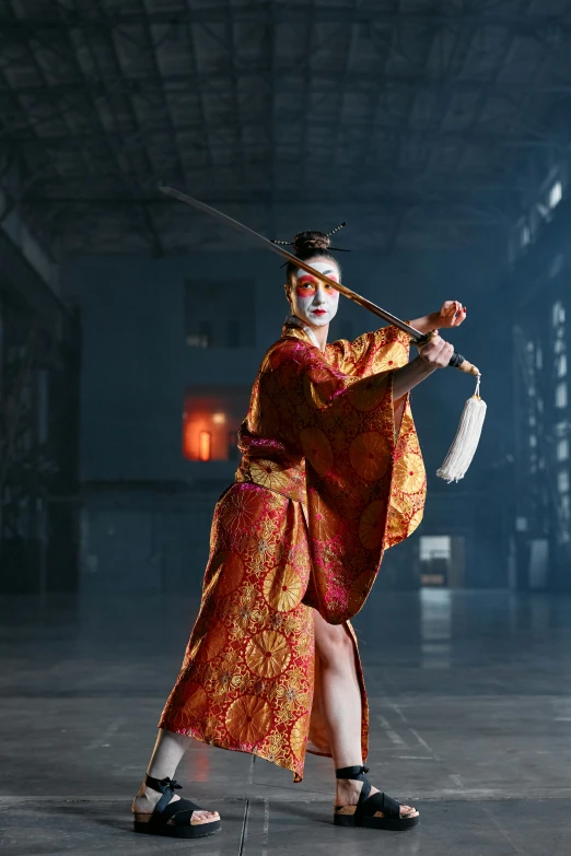 a woman in a kimono is holding a sword, pexels contest winner, theatrical scenery, epic stance, indoor shot, rectangle