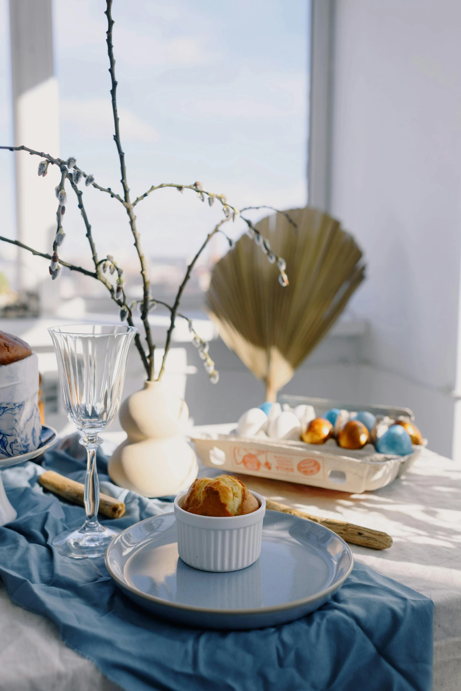 a close up of a plate of food on a table, easter, amber and blue color scheme, in a white boho style studio, seaview