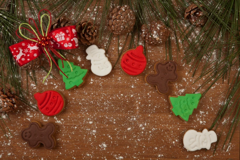 a wooden table topped with christmas cookies and decorations, inspired by Ernest William Christmas, pexels, folk art, background image, brown, pine, panel