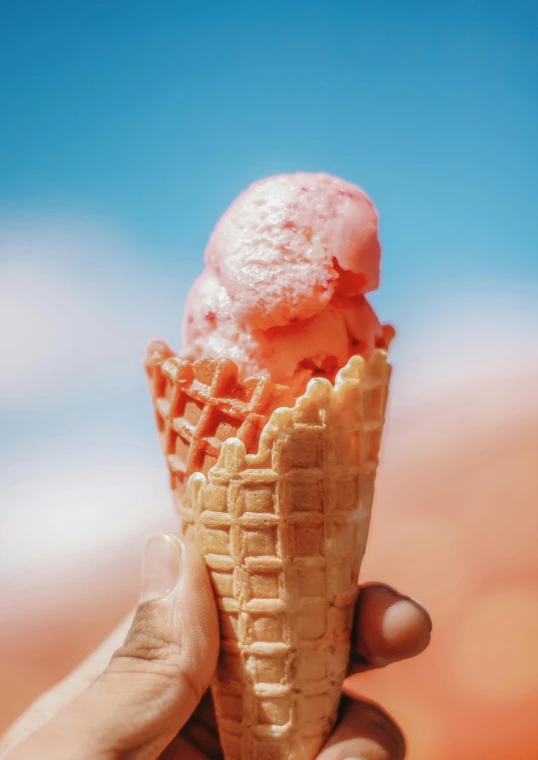 a person holding an ice cream cone in their hand, pexels contest winner, coral red, heaven pink, zoomed in, made of glazed