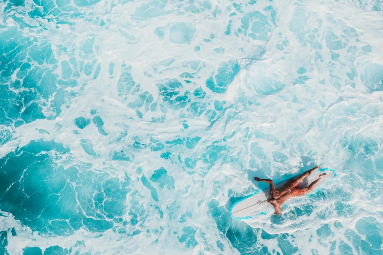 a person laying on a surfboard in the ocean, pexels contest winner, fine art, flat lay, full width, ocean pattern, featured art