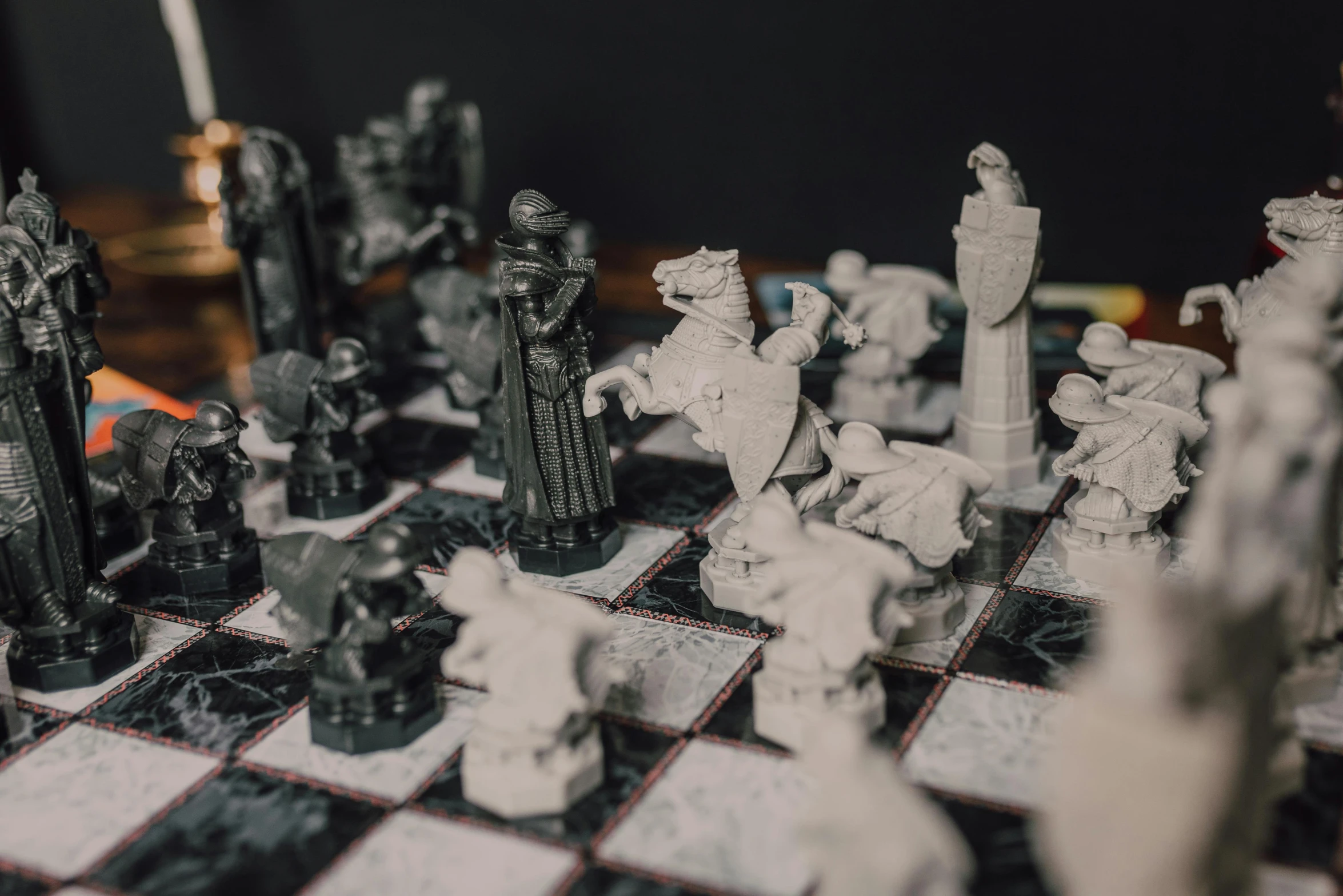 a close up of a chess board with figurines on it, a marble sculpture, by Adam Marczyński, unsplash contest winner, wizard fighting a golem, inside a rpg game, mignola, from of thrones