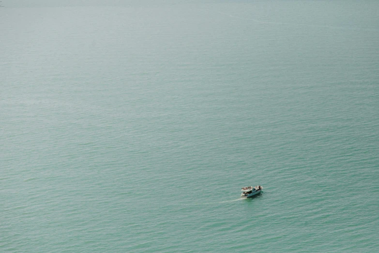 a small boat in the middle of a large body of water, by Elsa Bleda, abel tasman, still frame, 2 people, loneliness