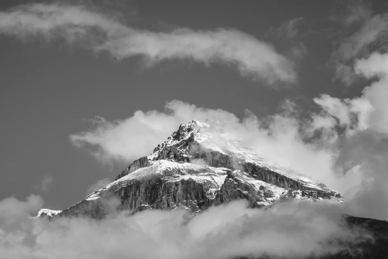 a black and white photo of a snow covered mountain, unsplash contest winner, castle made of clouds, chile, today\'s featured photograph 4k, climbing mountain in washington