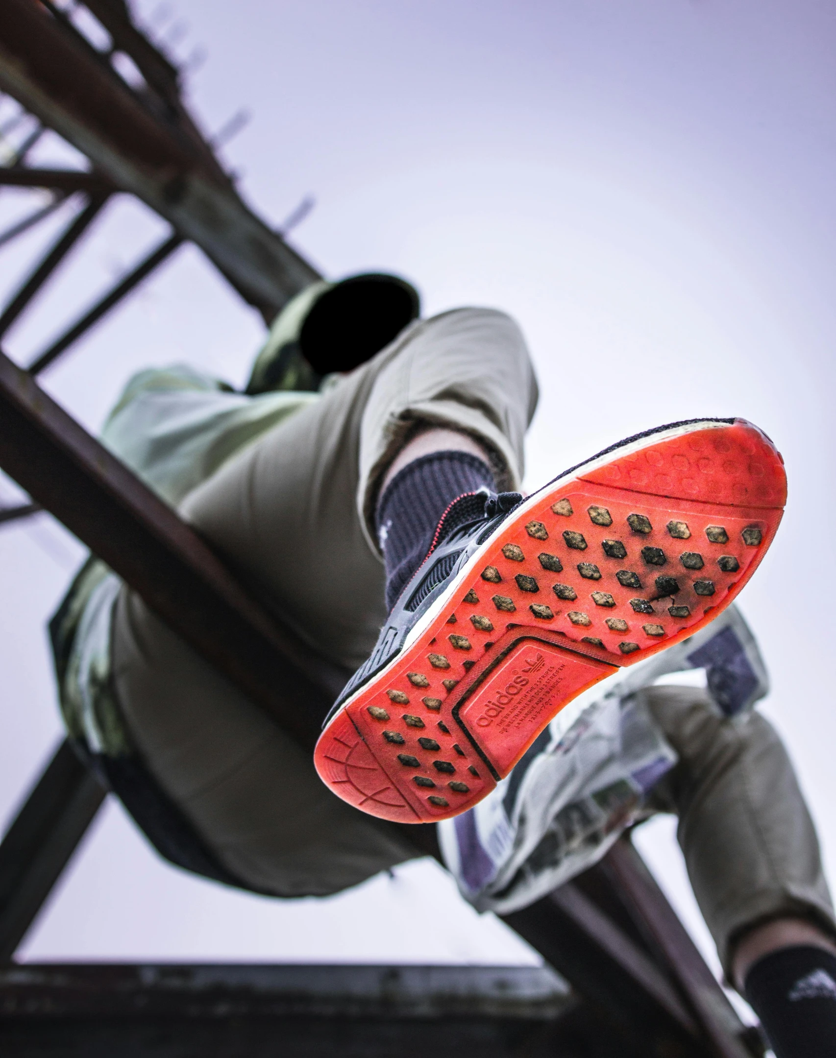 a man flying through the air while riding a skateboard, a colorized photo, inspired by Mike Winkelmann, pexels contest winner, happening, rubber waffle outsole, red and grey only, sitting on temple stairs, close up shot a rugged